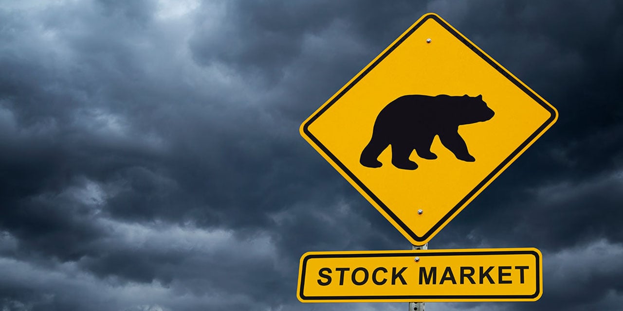 Street sign with a bear and the words 'stock market'.