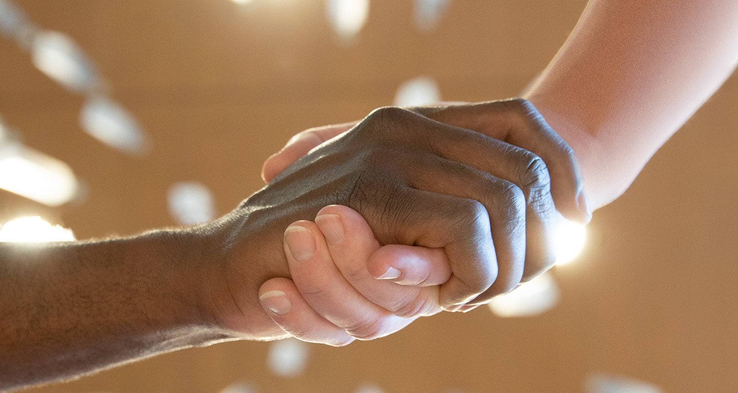 A closeup of two people shaking hands