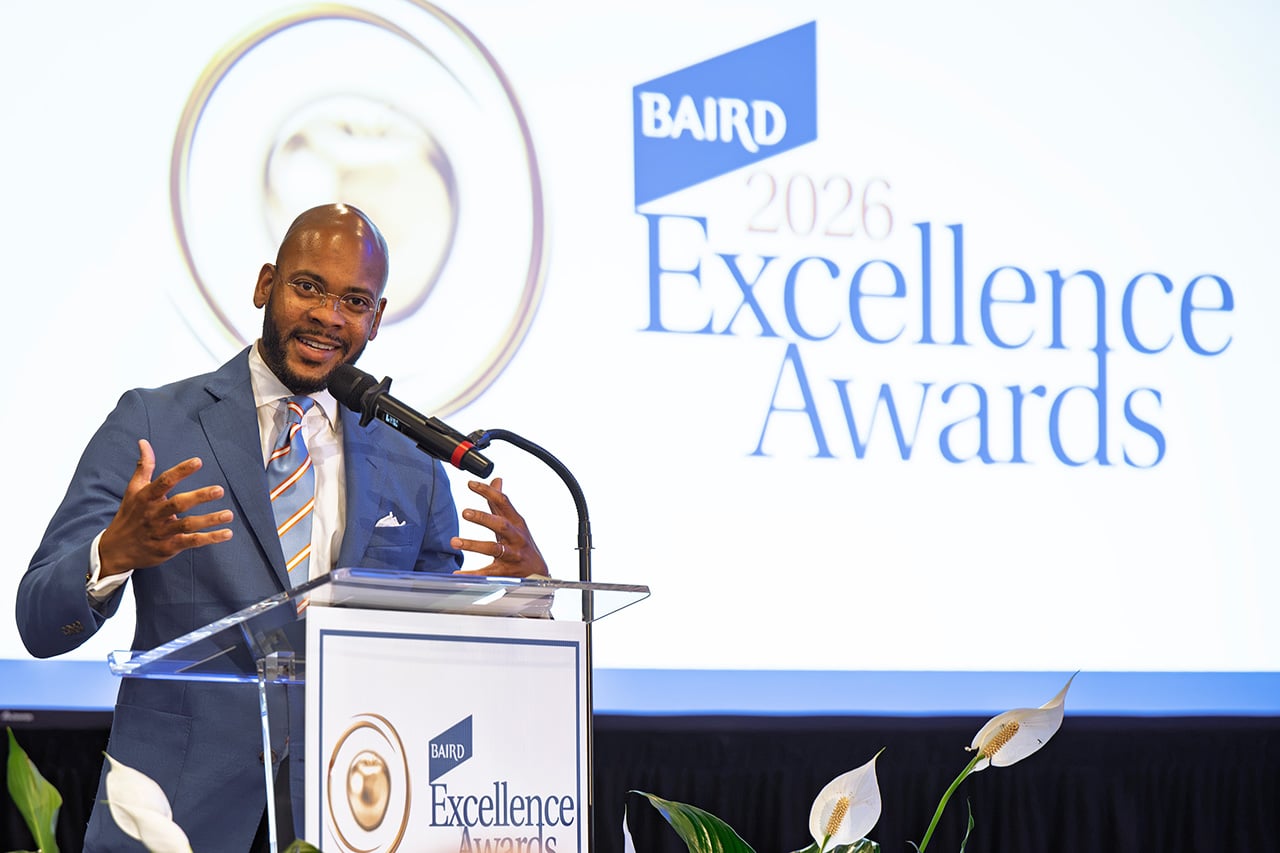 Speaker at a podium during the 2026 Excellence Awards