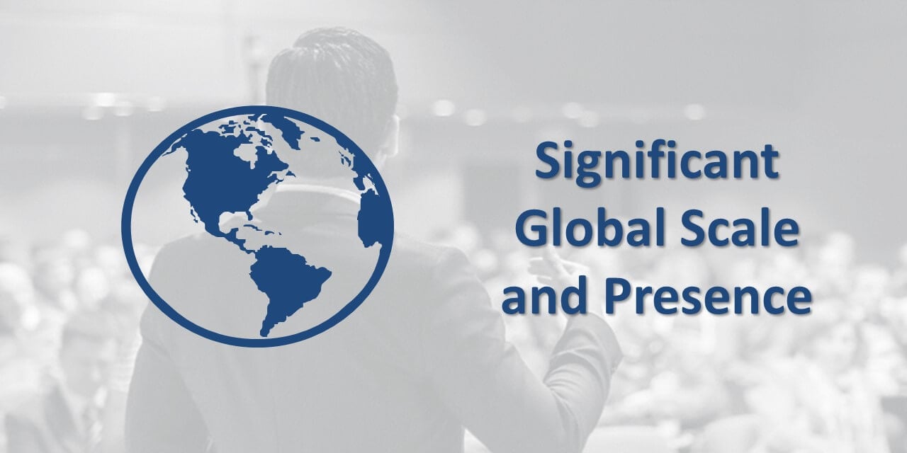 An icon of a globe with the words, "Significant Global Scale and Presence" against a faded black-and-white photo of a person presenting to a conference room