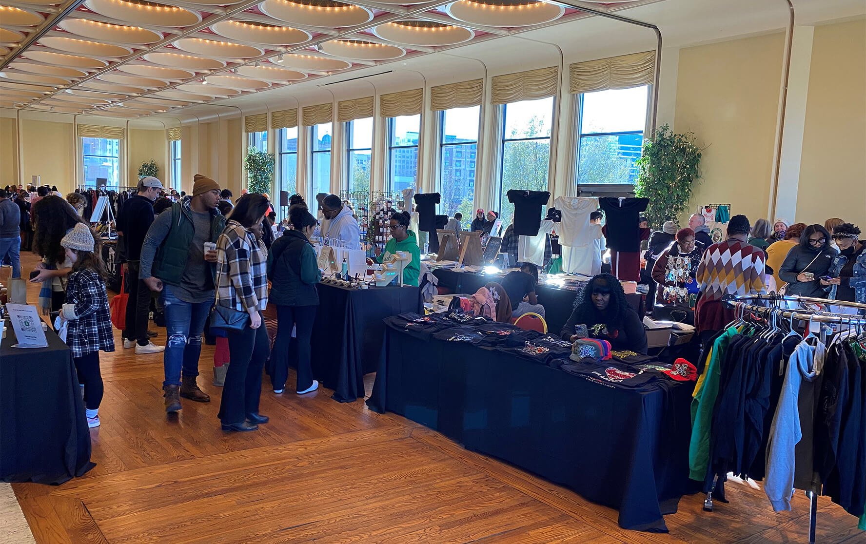 Shoppers browse booths at the HYFIN  inaugural Black holiday market