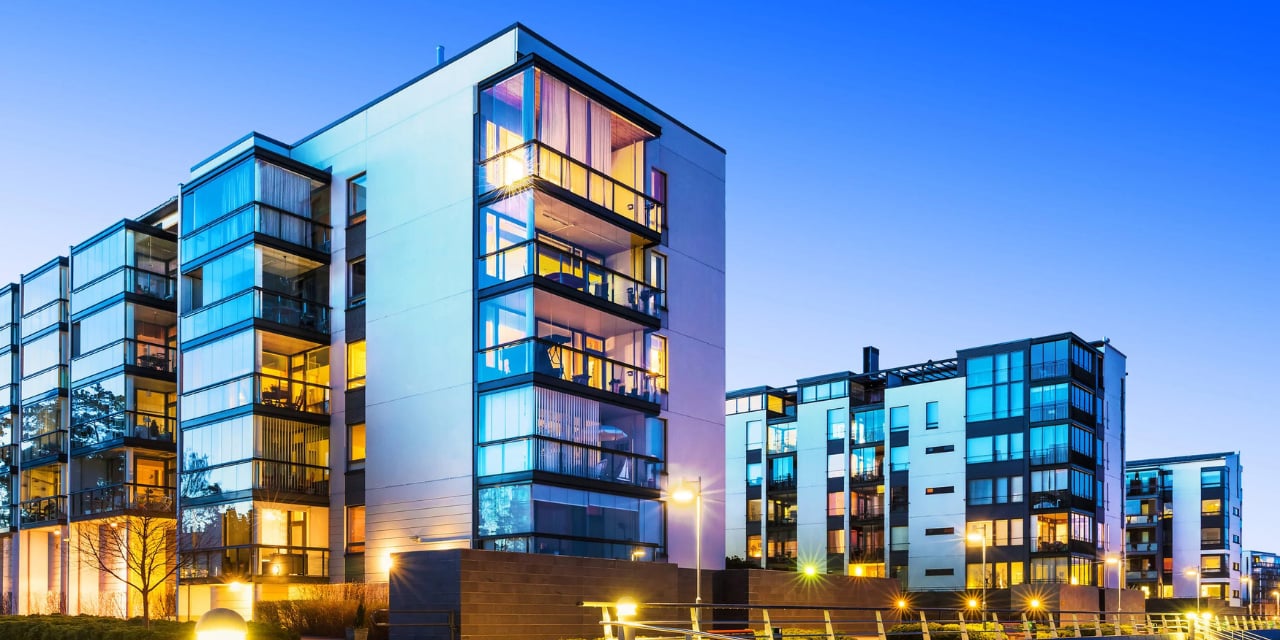A group of modern apartment buildings at twilight