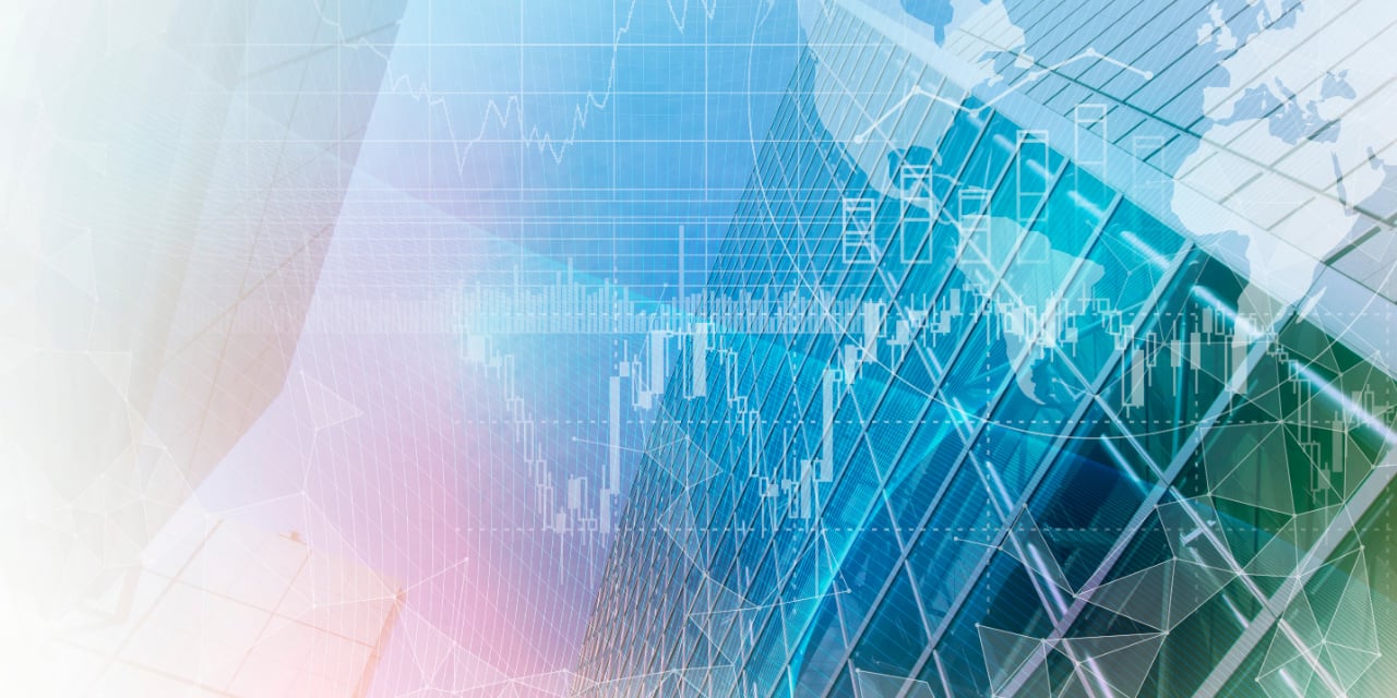 Abstract image of glass building with financial charts and global map overlay