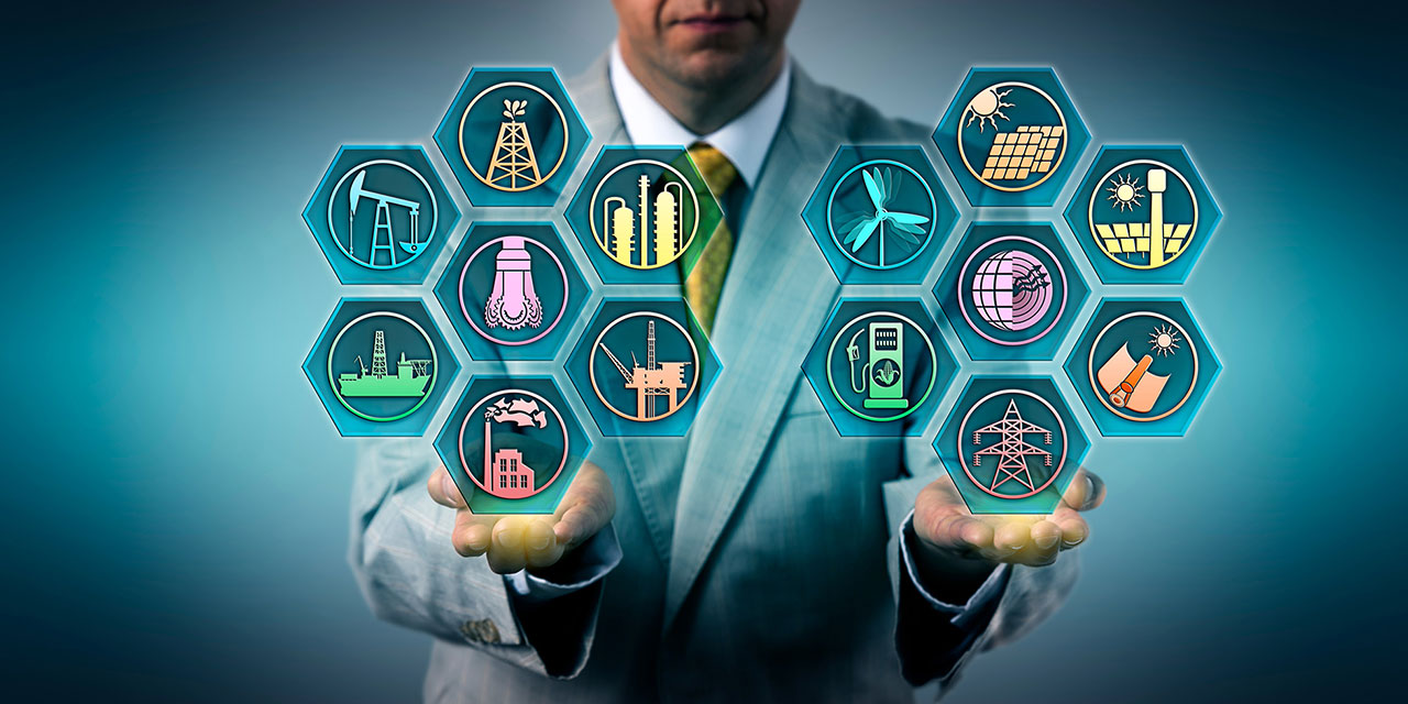 Man holding various energy related icons in his hands.