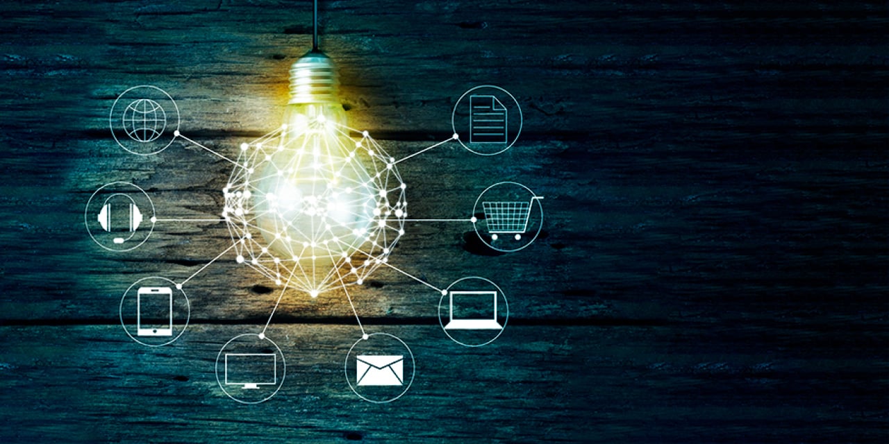 Lightbulb image with an overlay of technology icons