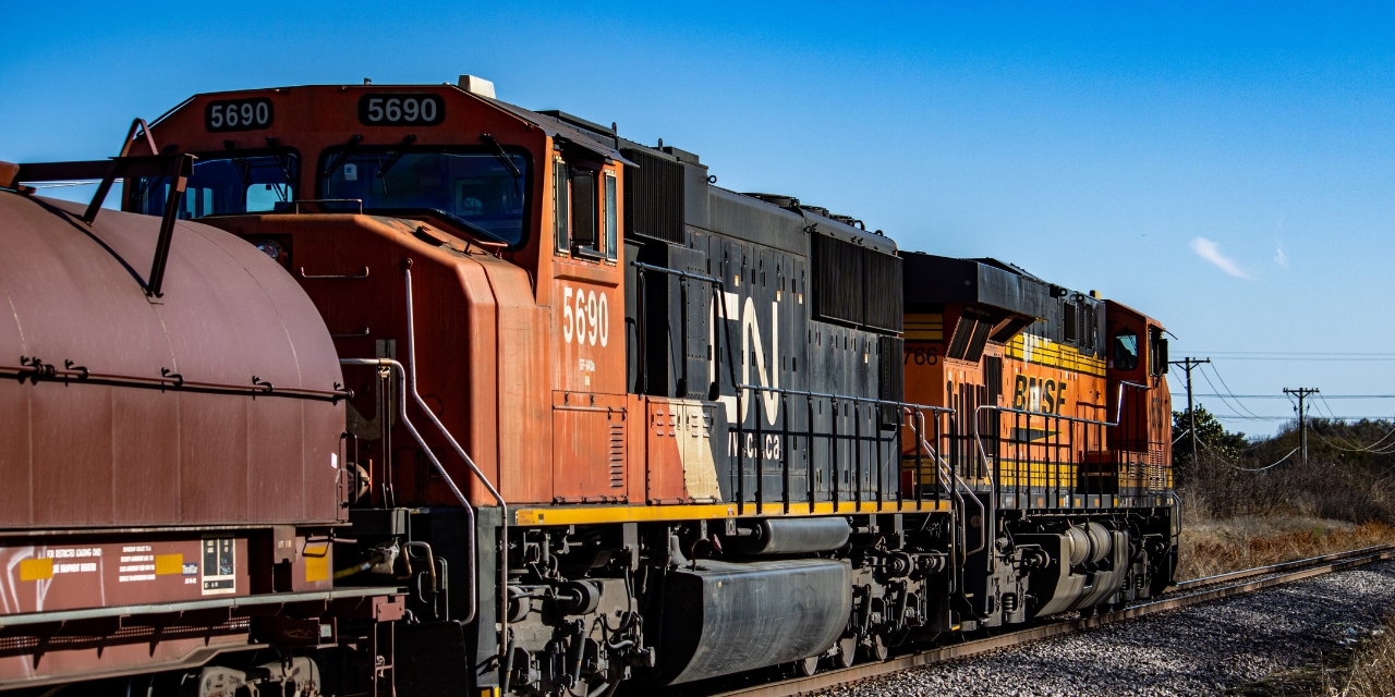 Train parked on a track during the day.