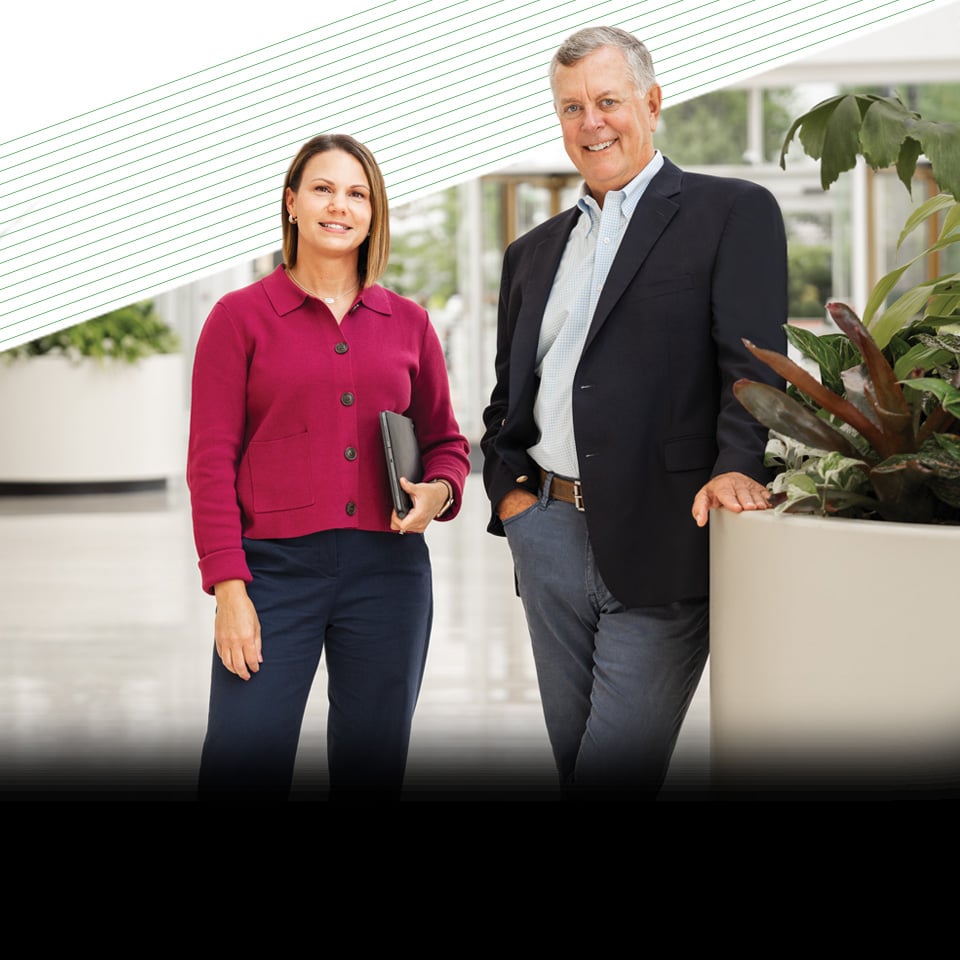 Two associates from Bairds Private Wealth Management business in an office setting