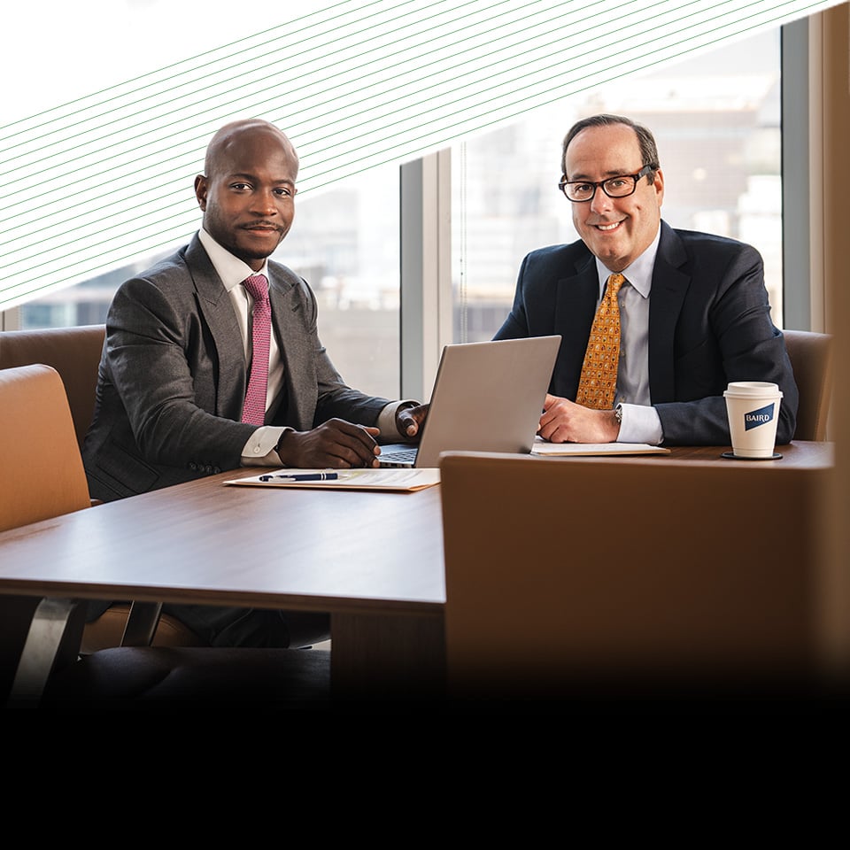 Two associates from Fixed Income Capital Markets in a conference room