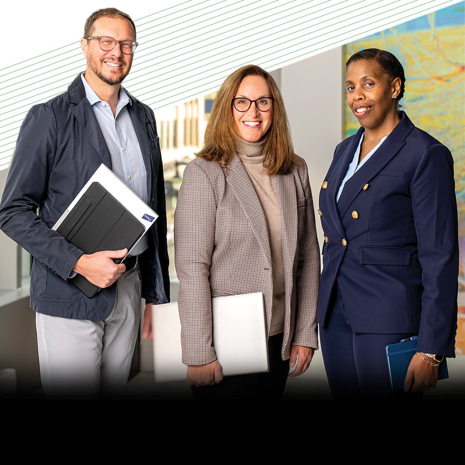 Three associates from Baird Corporate Resource Groups standing in Baird Center