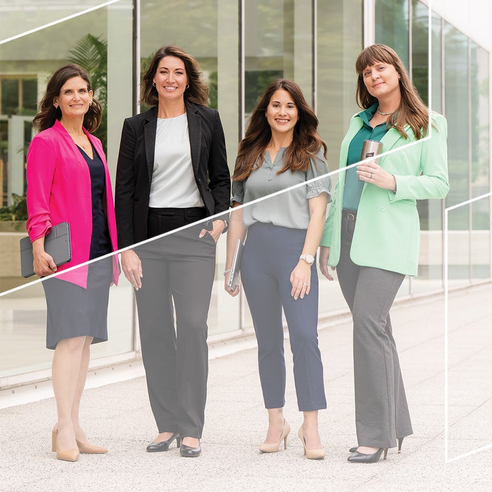 Four associates from Baird's Culture team outside Baird's Milwaukee headquarters