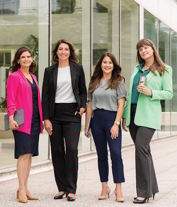 Four associates from Baird's Culture team outside Baird's Milwaukee headquarters