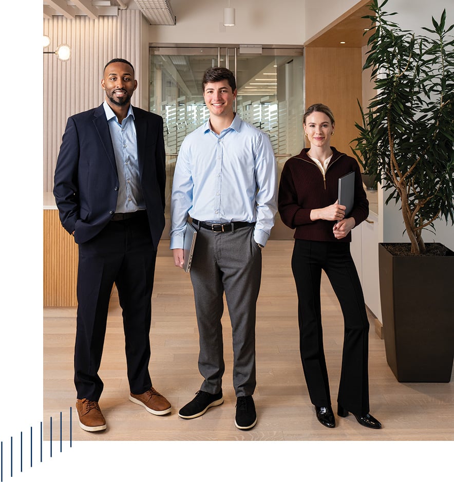 Three associates from Baird Equity Capital Markets in an office setting