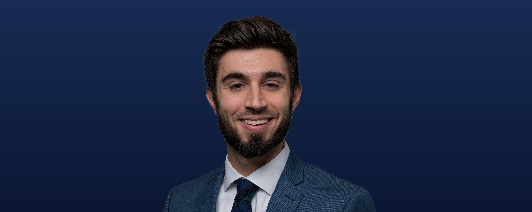 Ross Mayfield headshot with a dark blue background.