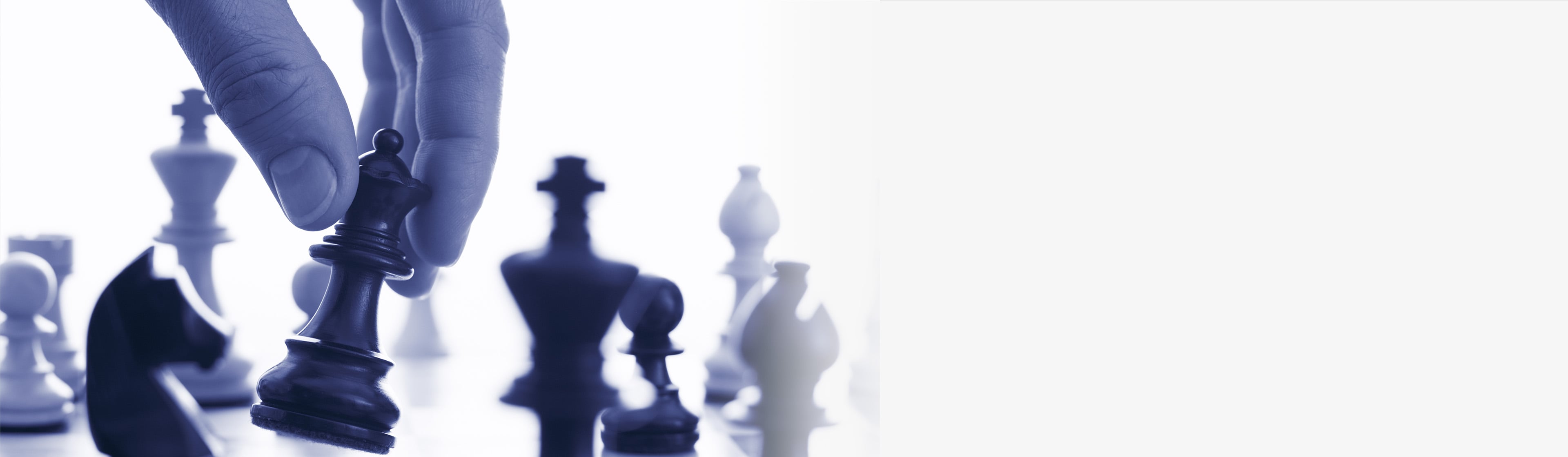 Hand holding chess piece