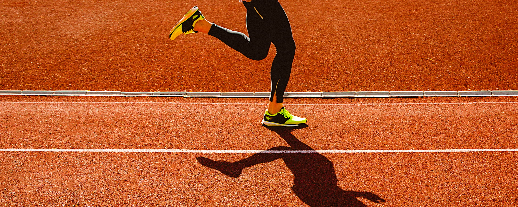 Person running on orange track