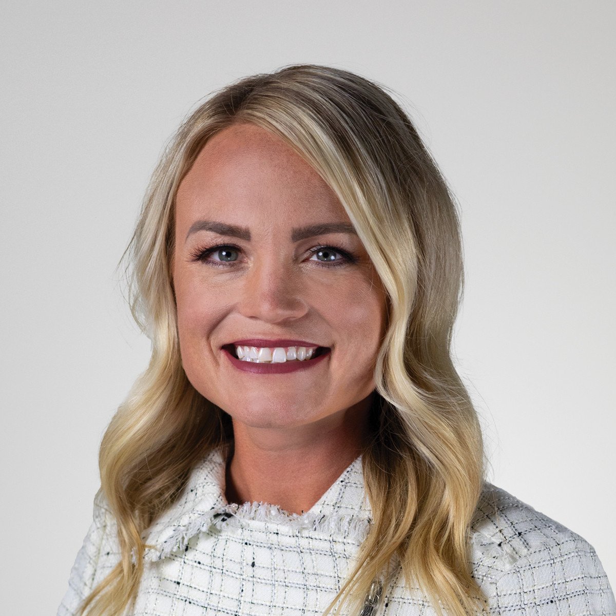 Stephanie Warren headshot on grey background