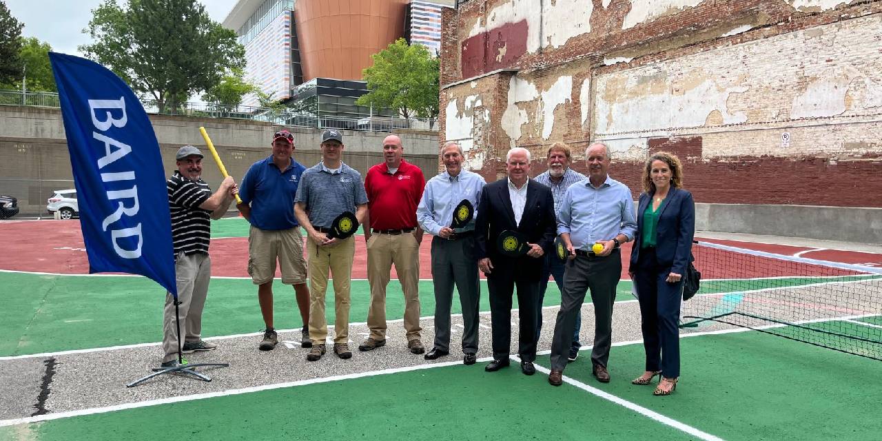 Louisville group of Baird associates at new athletic field.