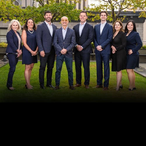 Team photo of the Atkins Group taken outside their Seattle office building