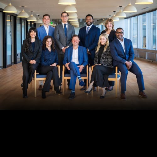 Team photo of the Hanson Slater Power Group taken in their Seattle office building