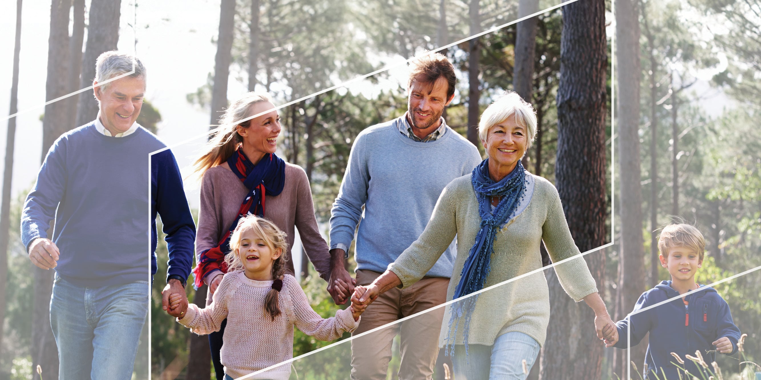 Multi-generational family walking outdoors framed by parallelograms in the shape of the Baird logo 
