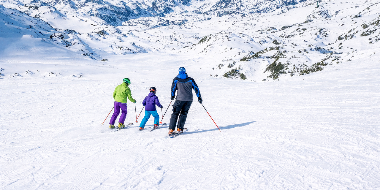 Family skiing in the mountains