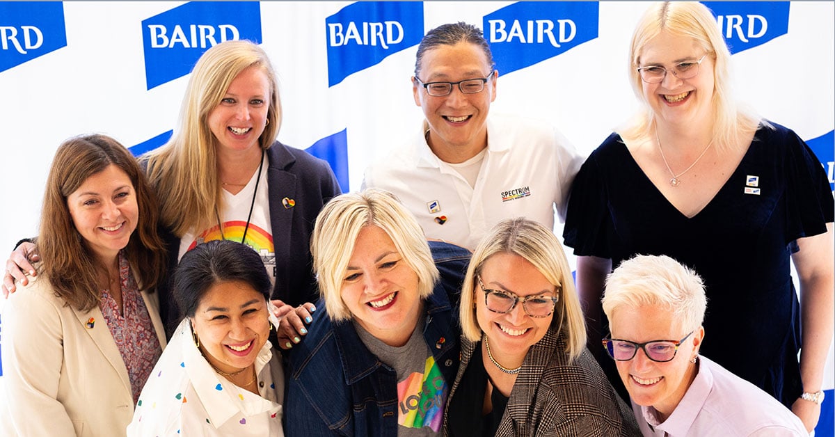 Group of associates taking group photo during Pride month