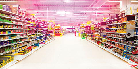 Photo of an aisle of a grocery store.