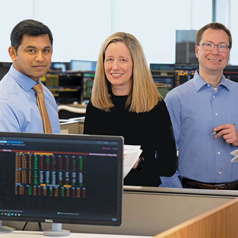 A photo of three associates on the Asset Management team