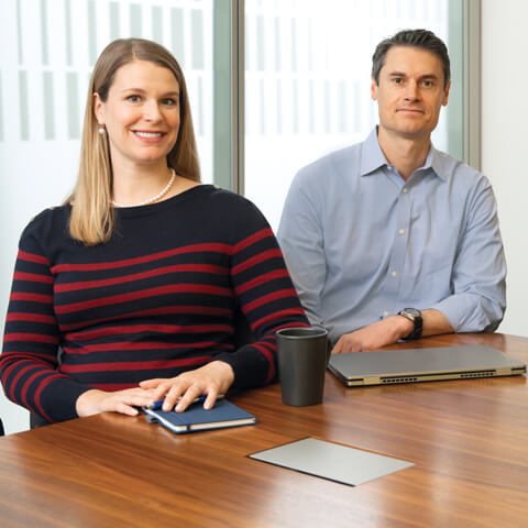 A photo of two associates from the Principal Investments team