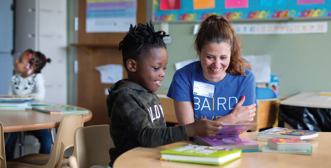 A Baird associate reads with an elementary school student