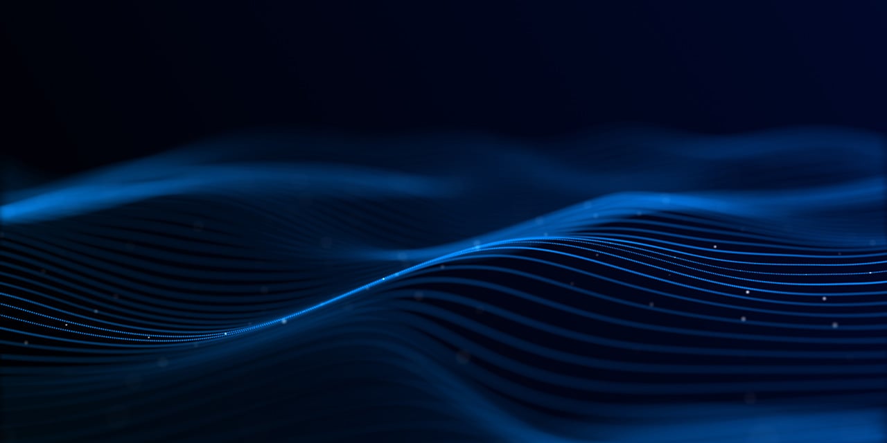 Flowing blue light waves forming smooth, glowing lines against a dark background.