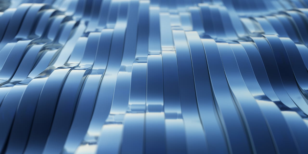 Abstract surface of wavy metallic blue strips creating a rippled, flowing texture.”