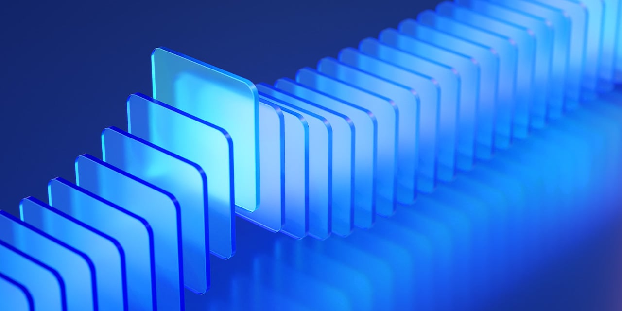 Row of glowing translucent blue panels arranged in a staggered line, creating a futuristic abstract look.