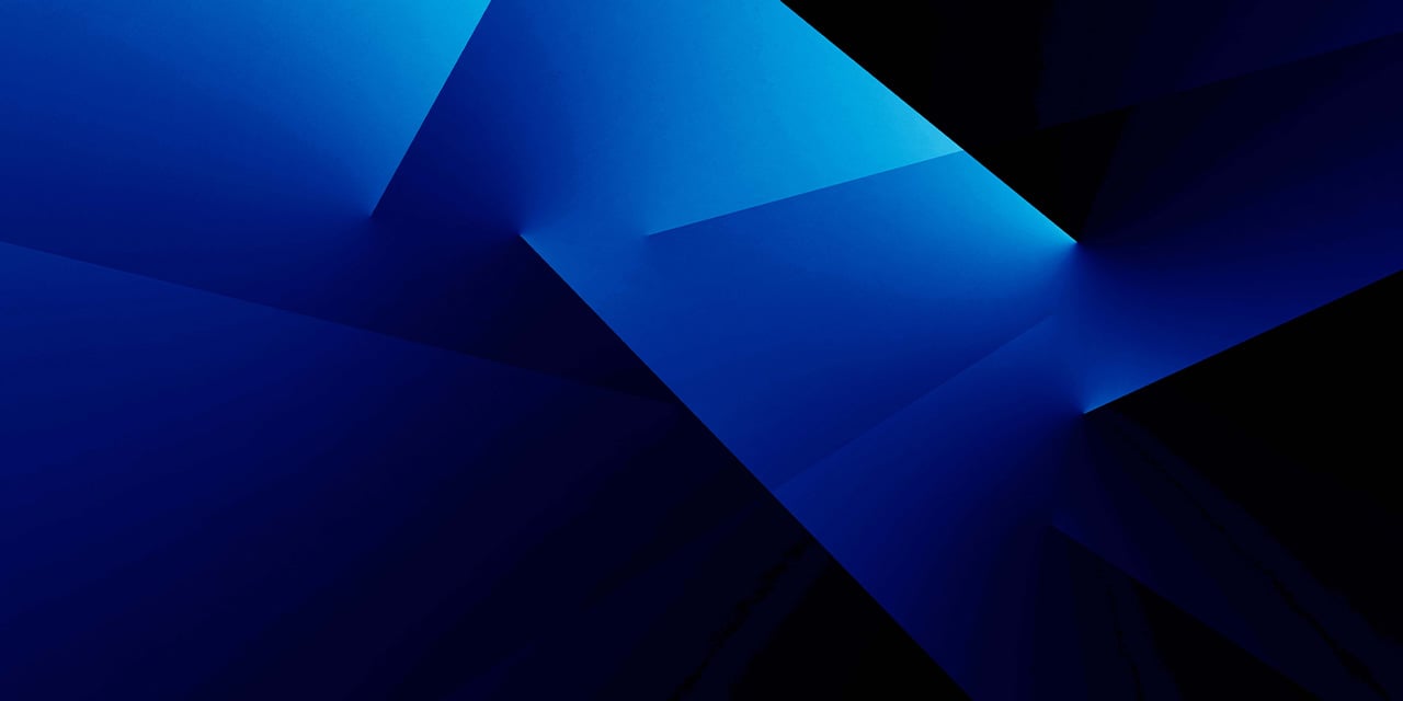 Abstract design of overlapping blue geometric shapes creating a glowing, faceted pattern on a dark background.