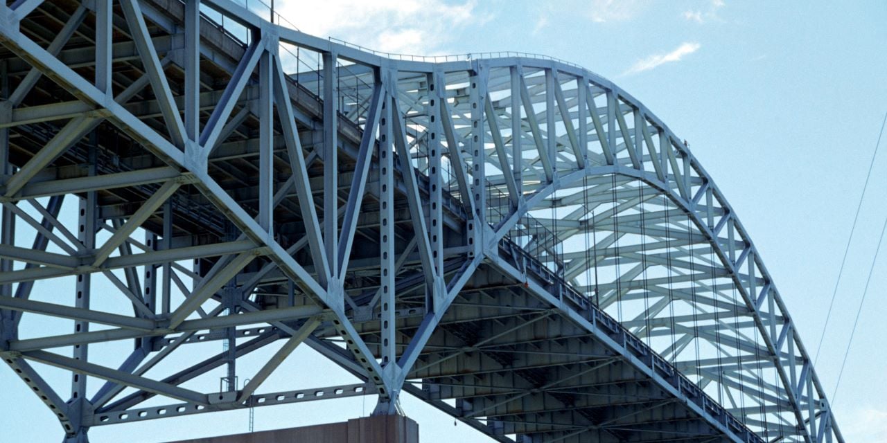 View of large bridge during the day.