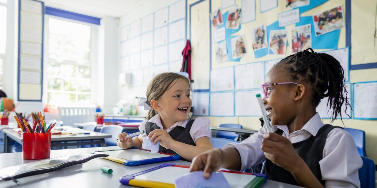 Group of smiling school-age girls together