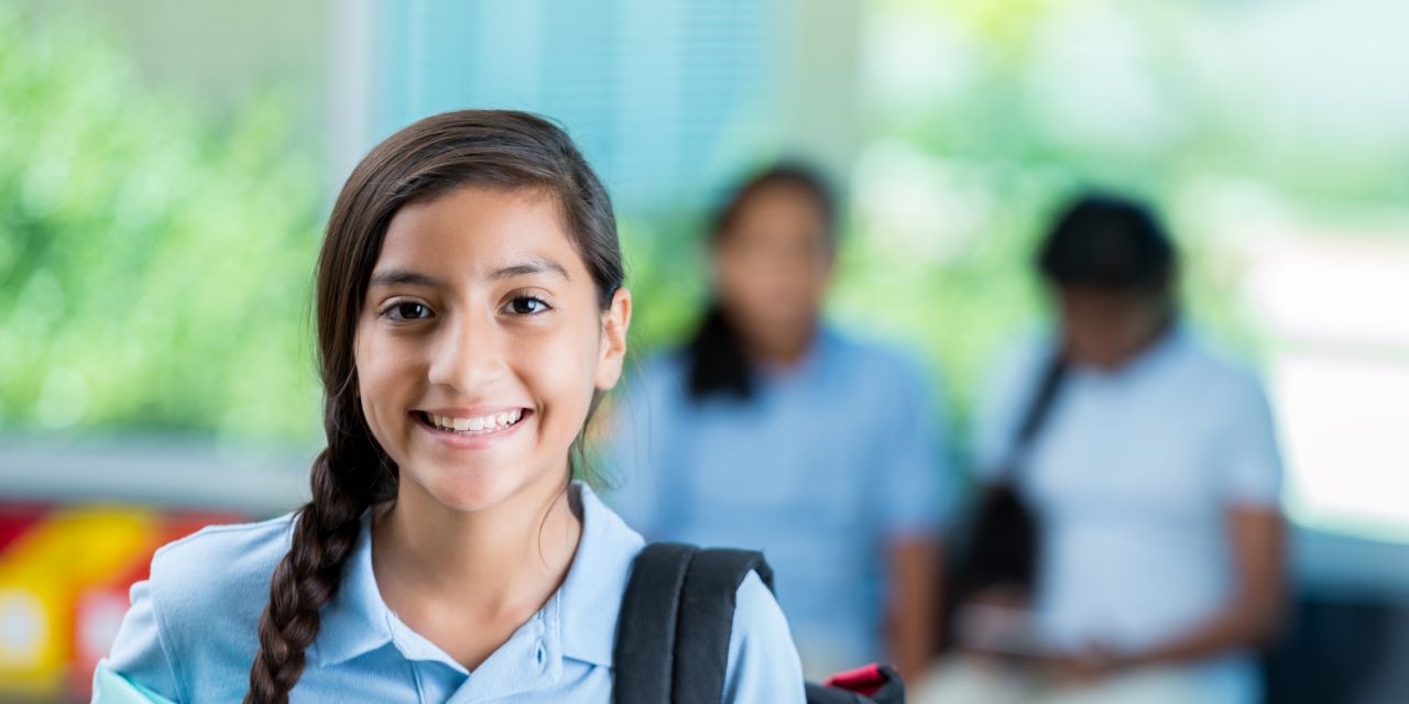 Charter school girl smiling confidently
