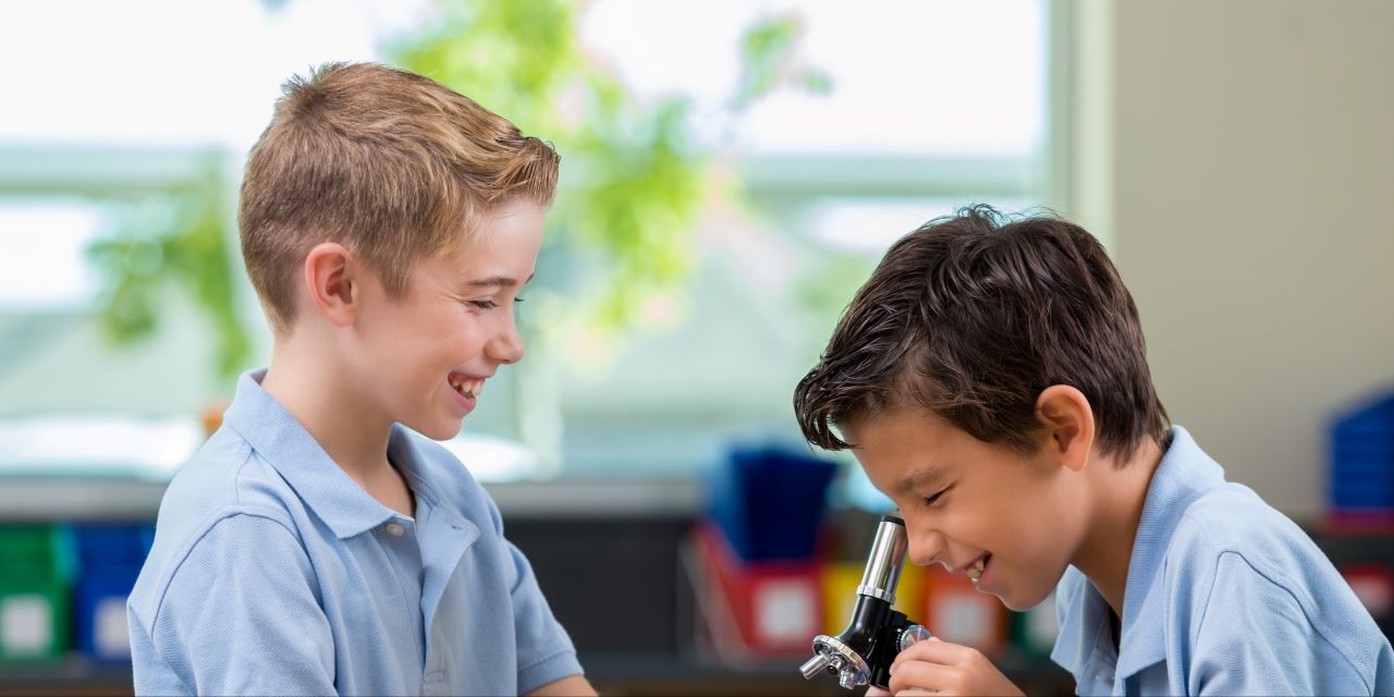 Boys sitting and learning in classroom