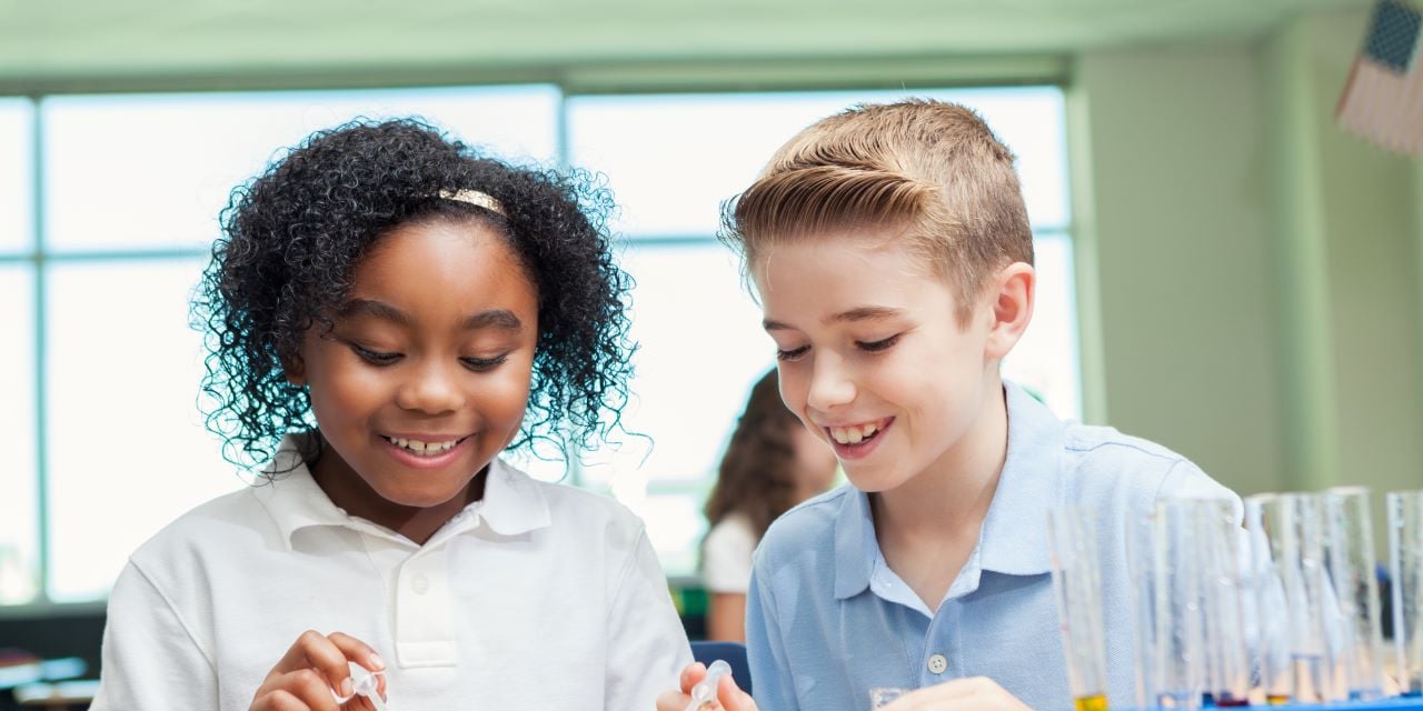 Children participating in science class