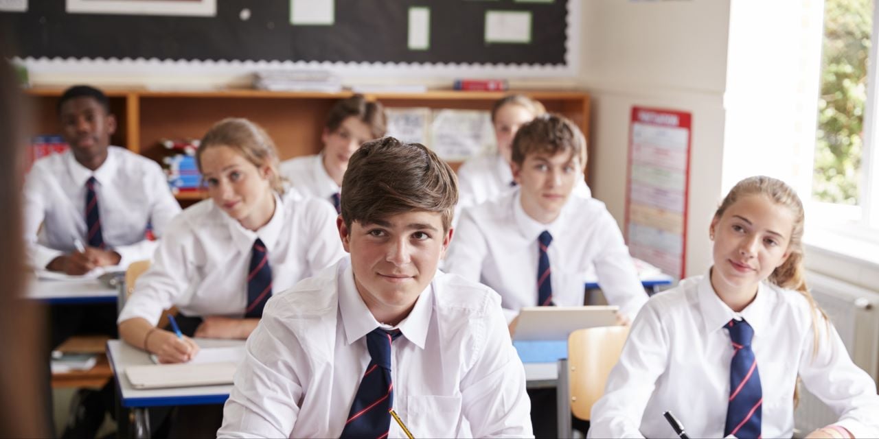 Boys sitting and learning in classroom