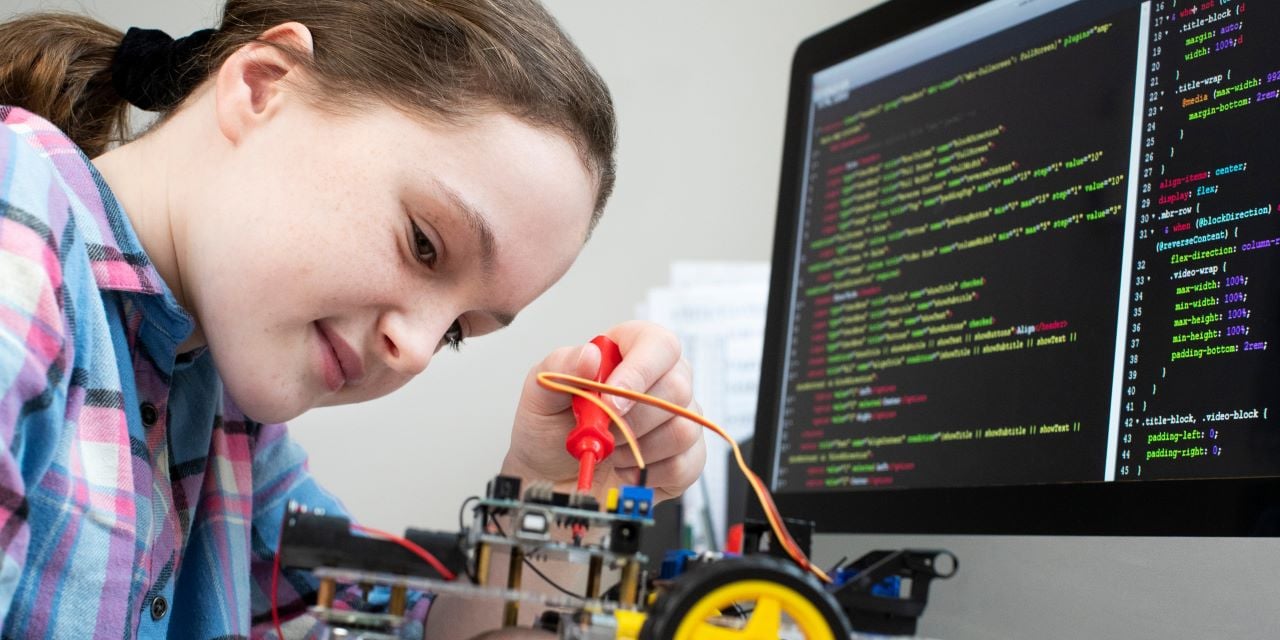 Girl using a computer for learning at school