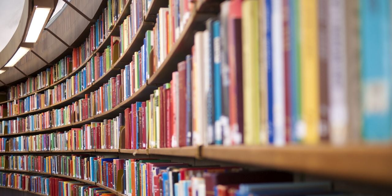 Closeup view of shelves of books in a library.