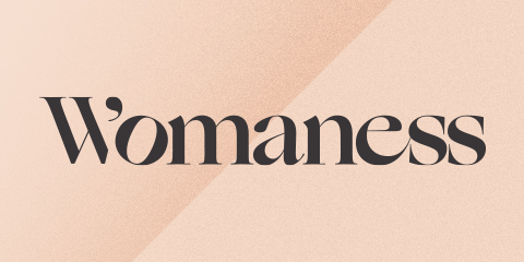 Womaness logo with a tan background.