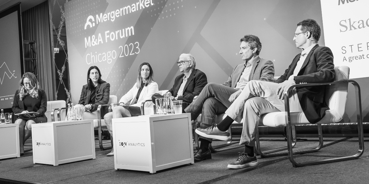 Panel on stage at the Mergermarket M&A Forum in Chicago in 2023